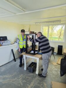 2 men assembling cabinet
